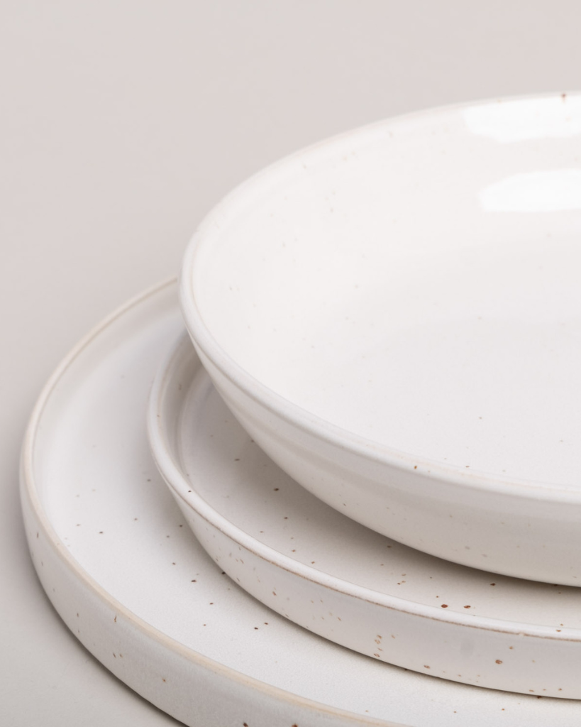 Elevate your dining experience with our handcrafted Calma dinner plate. Each 27cm plate features natural glaze variations and improved stackable design. Perfectly sized for main courses, this dishwasher-safe plate combines artisanal beauty with modern practicality.