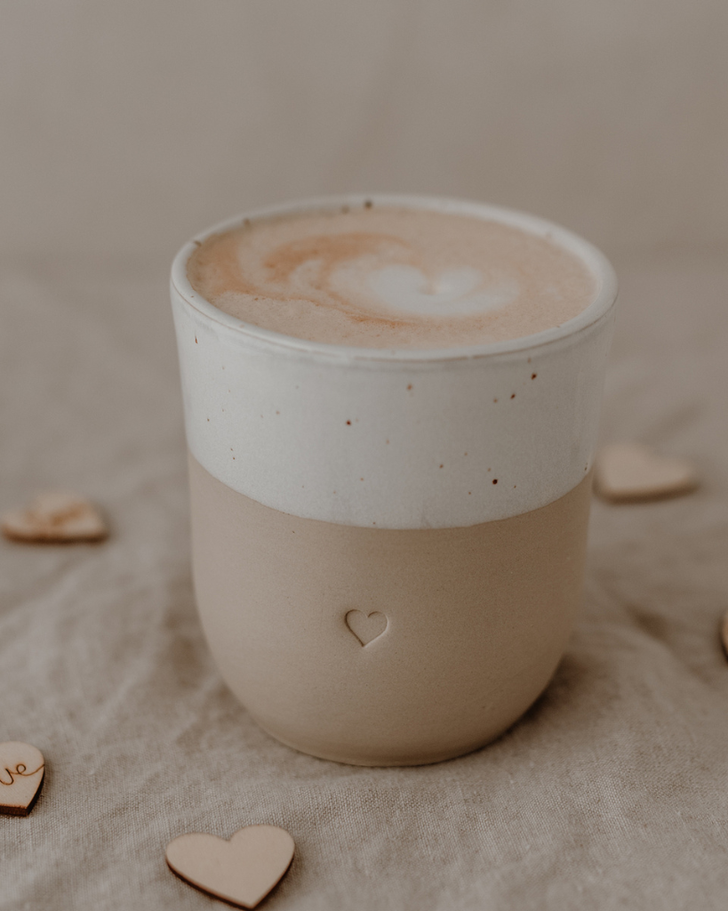 Discover the charm of handmade pottery with our exclusive stoneware heart mug. Each 320ml mug is carefully crafted in a small Portuguese pottery, featuring a beautiful embossed heart design. Every piece is unique, showcasing subtle variations in glaze and texture that make it truly special. Combining practicality with artisanal beauty, these dishwasher-safe mugs measure 8.5-9cm in height, perfect for your daily coffee or tea ritual.