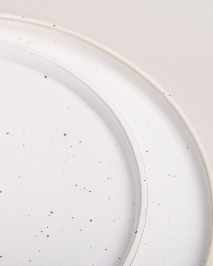Elevate your dining experience with our handcrafted Calma dinner plate. Each 27cm plate features natural glaze variations and improved stackable design. Perfectly sized for main courses, this dishwasher-safe plate combines artisanal beauty with modern practicality.