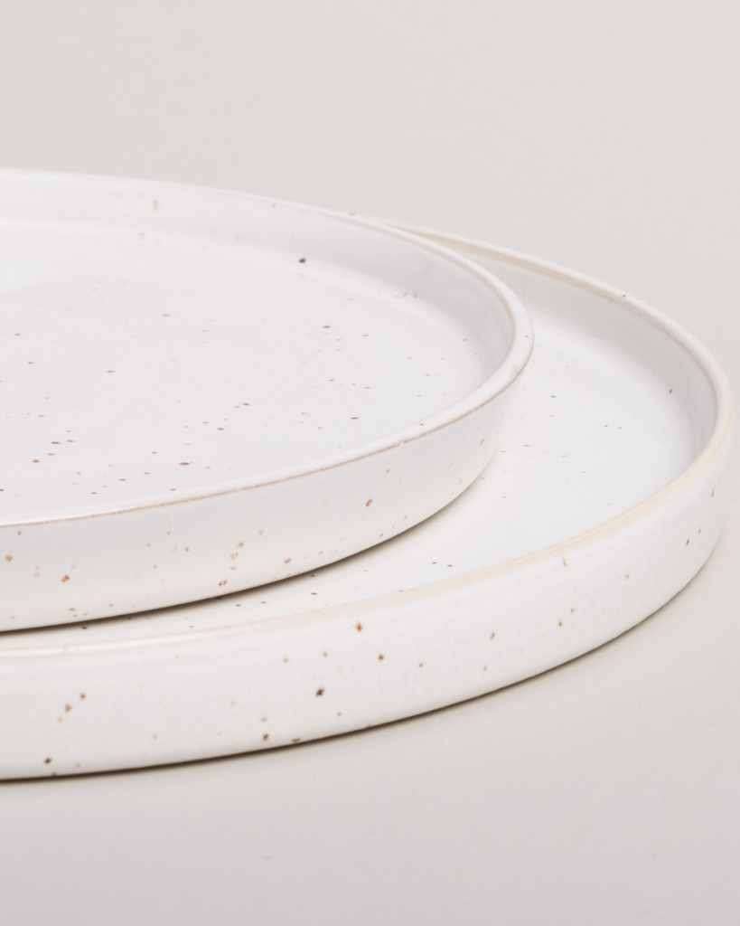 Elevate your dining experience with our handcrafted Calma dinner plate. Each 27cm plate features natural glaze variations and improved stackable design. Perfectly sized for main courses, this dishwasher-safe plate combines artisanal beauty with modern practicality.