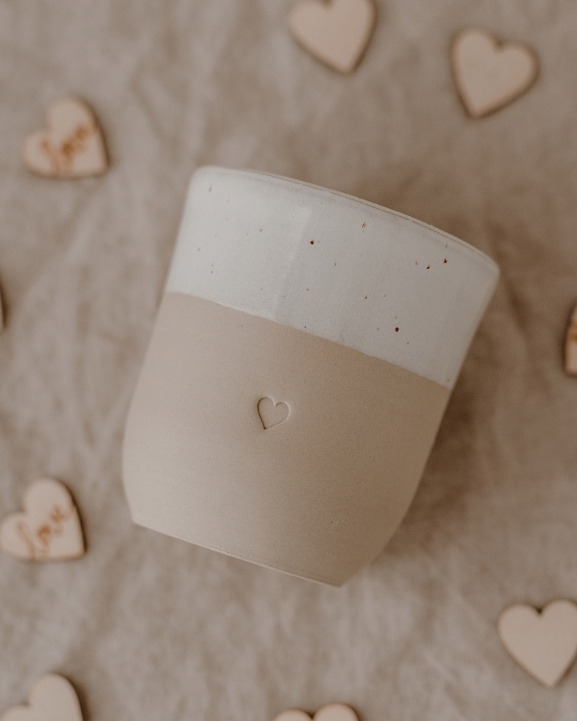 Discover the charm of handmade pottery with our exclusive stoneware heart mug. Each 320ml mug is carefully crafted in a small Portuguese pottery, featuring a beautiful embossed heart design. Every piece is unique, showcasing subtle variations in glaze and texture that make it truly special. Combining practicality with artisanal beauty, these dishwasher-safe mugs measure 8.5-9cm in height, perfect for your daily coffee or tea ritual.