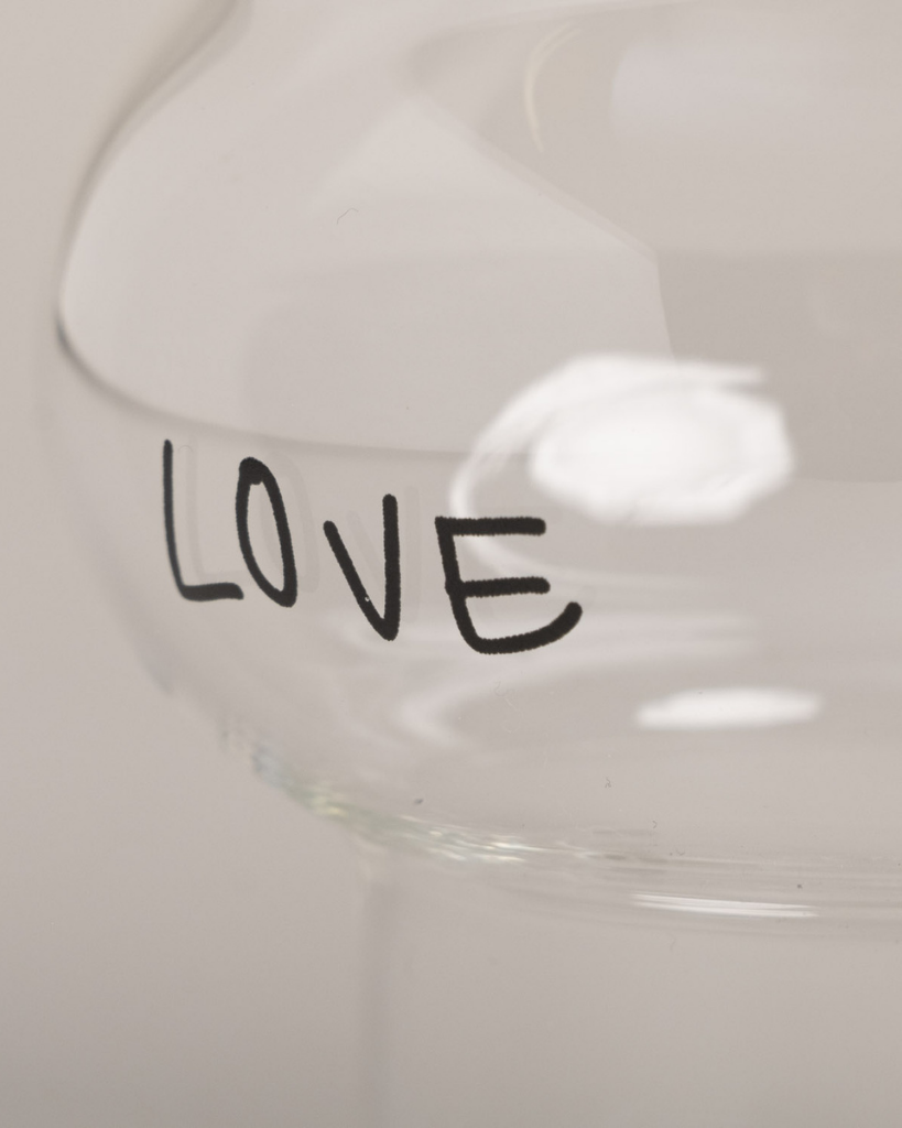Celebrate love with our Double Bubble glass featuring elegant "Love" lettering and heart detail. This 450ml glass combines style with sentiment, perfect for special occasions or adding romance to everyday moments. Standing elegantly at 12.8cm tall with an 8.9cm width, it's perfectly sized for everything from refreshing cocktails to creative desserts. Dishwasher safe.
