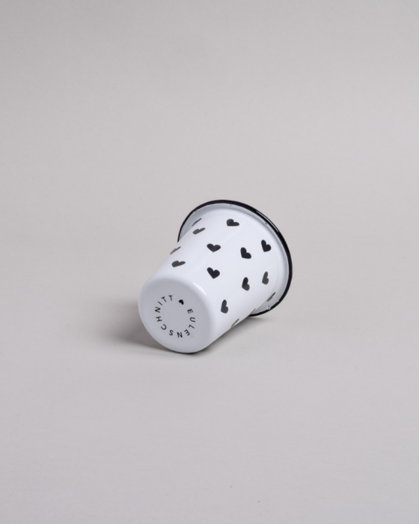 Heart Pattern Enamel Camping Mug | 290ml | Outdoor & Camping Essential Add joy to your outdoor adventures with this charming enamel mug featuring delicate black hearts. Built tough for camping and picnics, this 290ml mug combines vintage style with modern durability. Dishwasher safe and easy to clean, it's perfect for hot drinks around the campfire or backyard gatherings. The sturdy enamel construction ensures long-lasting use while its compact size (9cm x 8.6cm) makes it ideal for camping kits and outdoor dining.