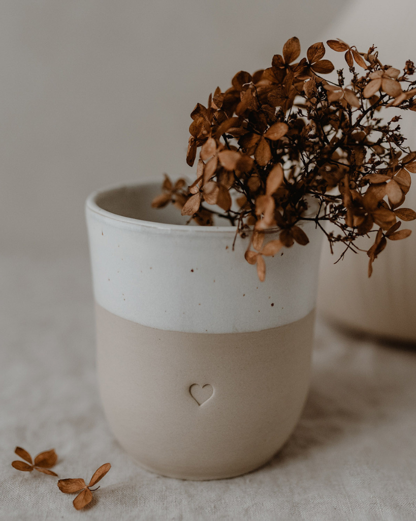 Discover the charm of handmade pottery with our exclusive stoneware heart mug. Each 320ml mug is carefully crafted in a small Portuguese pottery, featuring a beautiful embossed heart design. Every piece is unique, showcasing subtle variations in glaze and texture that make it truly special. Combining practicality with artisanal beauty, these dishwasher-safe mugs measure 8.5-9cm in height, perfect for your daily coffee or tea ritual.
