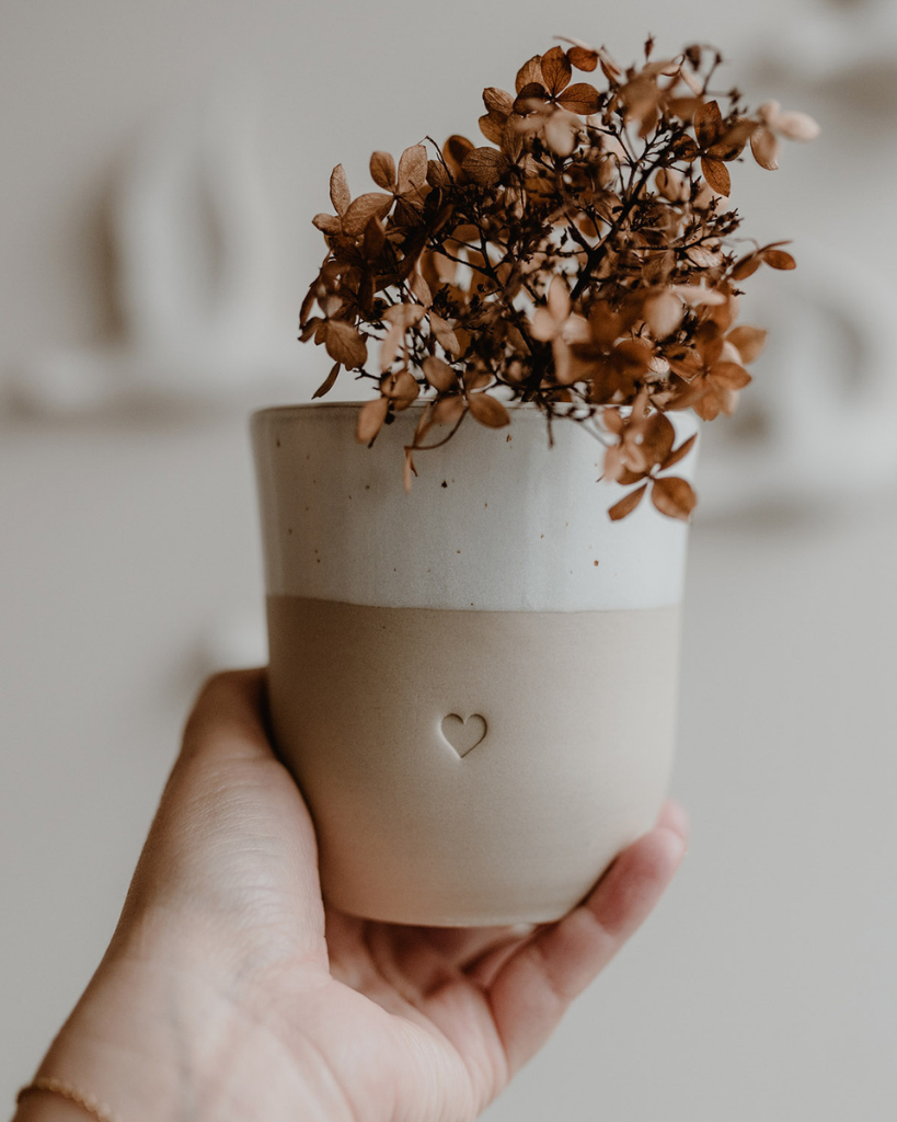 Discover the charm of handmade pottery with our exclusive stoneware heart mug. Each 320ml mug is carefully crafted in a small Portuguese pottery, featuring a beautiful embossed heart design. Every piece is unique, showcasing subtle variations in glaze and texture that make it truly special. Combining practicality with artisanal beauty, these dishwasher-safe mugs measure 8.5-9cm in height, perfect for your daily coffee or tea ritual.