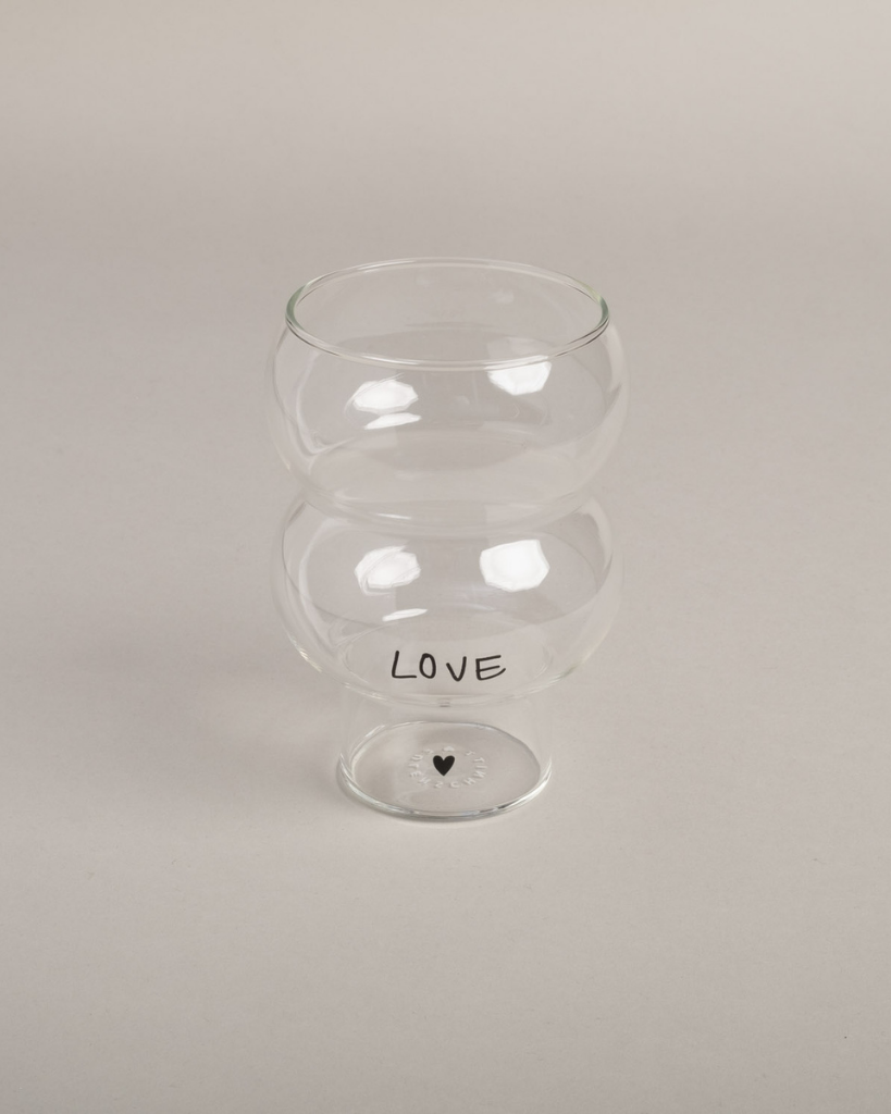 Celebrate love with our Double Bubble glass featuring elegant "Love" lettering and heart detail. This 450ml glass combines style with sentiment, perfect for special occasions or adding romance to everyday moments. Standing elegantly at 12.8cm tall with an 8.9cm width, it's perfectly sized for everything from refreshing cocktails to creative desserts. Dishwasher safe.