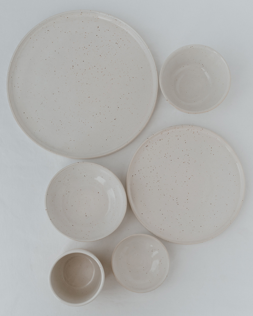 Elevate your dining experience with our handcrafted Calma dinner plate. Each 27cm plate features natural glaze variations and improved stackable design. Perfectly sized for main courses, this dishwasher-safe plate combines artisanal beauty with modern practicality.