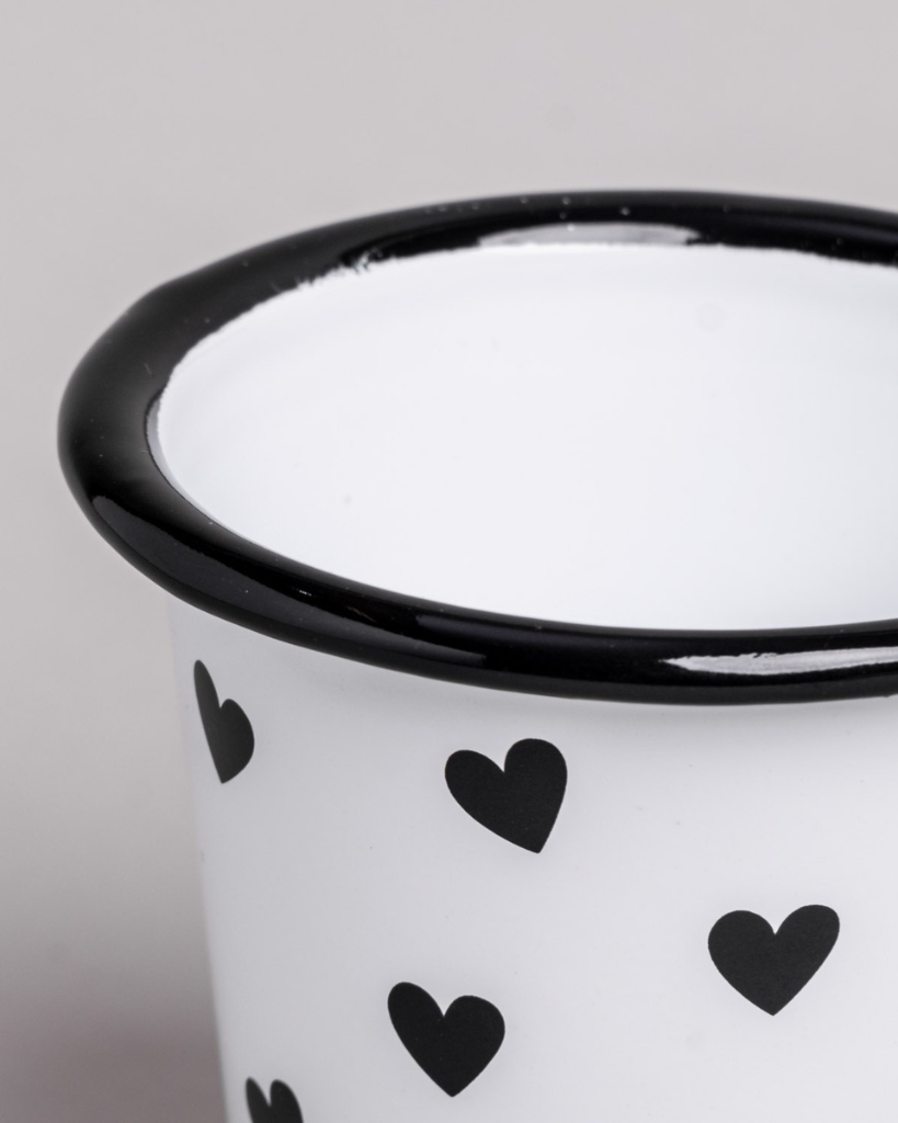 Heart Pattern Enamel Camping Mug | 290ml | Outdoor & Camping Essential Add joy to your outdoor adventures with this charming enamel mug featuring delicate black hearts. Built tough for camping and picnics, this 290ml mug combines vintage style with modern durability. Dishwasher safe and easy to clean, it's perfect for hot drinks around the campfire or backyard gatherings. The sturdy enamel construction ensures long-lasting use while its compact size (9cm x 8.6cm) makes it ideal for camping kits and outdoor dining.