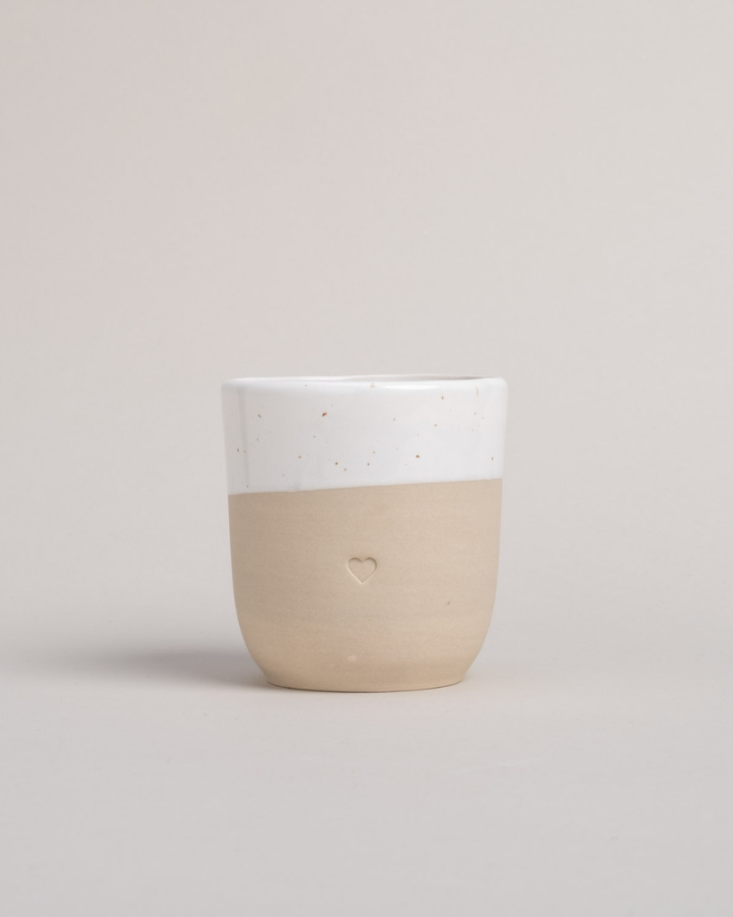 Discover the charm of handmade pottery with our exclusive stoneware heart mug. Each 320ml mug is carefully crafted in a small Portuguese pottery, featuring a beautiful embossed heart design. Every piece is unique, showcasing subtle variations in glaze and texture that make it truly special. Combining practicality with artisanal beauty, these dishwasher-safe mugs measure 8.5-9cm in height, perfect for your daily coffee or tea ritual.