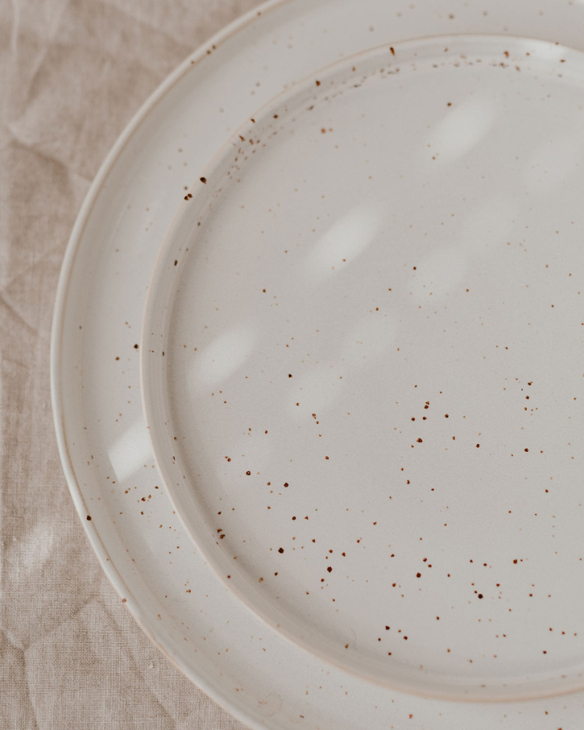 Elevate your dining experience with our handcrafted Calma dinner plate. Each 27cm plate features natural glaze variations and improved stackable design. Perfectly sized for main courses, this dishwasher-safe plate combines artisanal beauty with modern practicality.