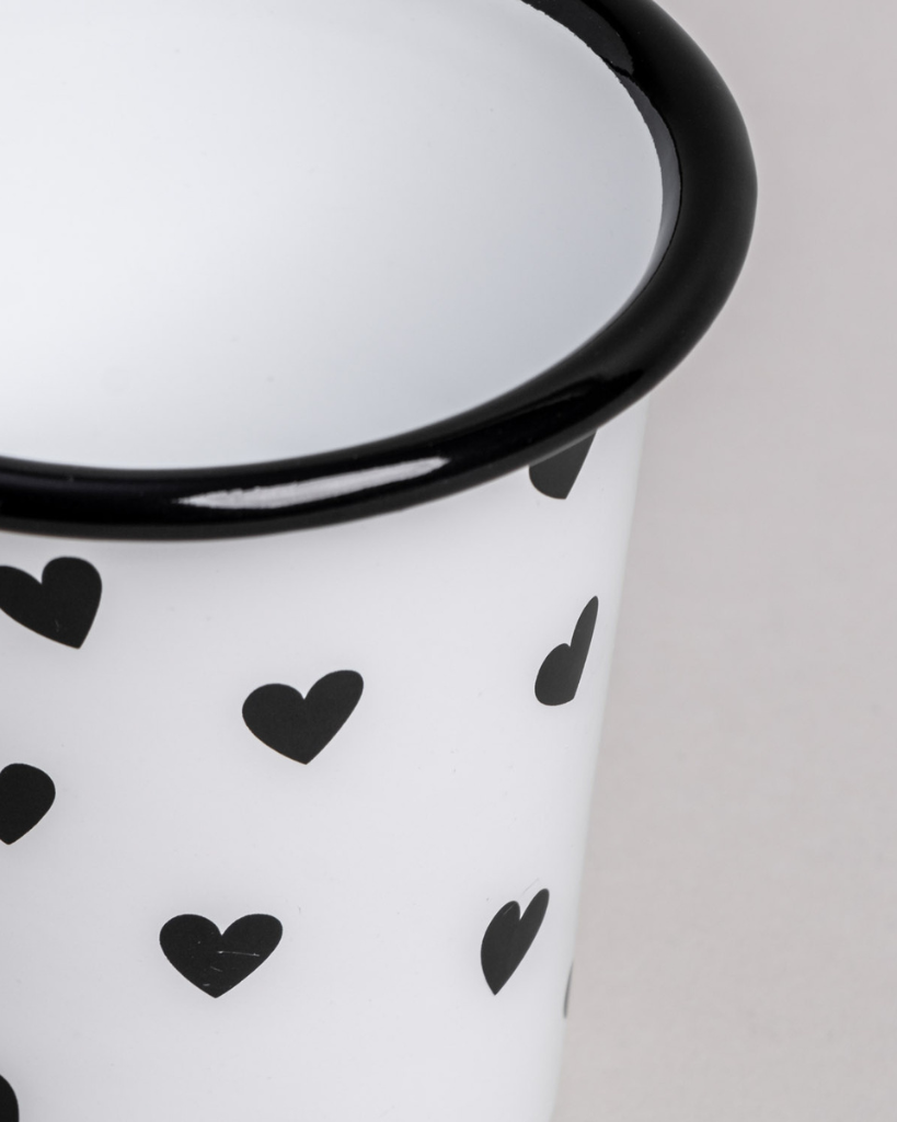 Heart Pattern Enamel Camping Mug | 290ml | Outdoor & Camping Essential Add joy to your outdoor adventures with this charming enamel mug featuring delicate black hearts. Built tough for camping and picnics, this 290ml mug combines vintage style with modern durability. Dishwasher safe and easy to clean, it's perfect for hot drinks around the campfire or backyard gatherings. The sturdy enamel construction ensures long-lasting use while its compact size (9cm x 8.6cm) makes it ideal for camping kits and outdoor dining.