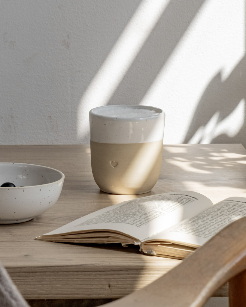 Discover the charm of handmade pottery with our exclusive stoneware heart mug. Each 320ml mug is carefully crafted in a small Portuguese pottery, featuring a beautiful embossed heart design. Every piece is unique, showcasing subtle variations in glaze and texture that make it truly special. Combining practicality with artisanal beauty, these dishwasher-safe mugs measure 8.5-9cm in height, perfect for your daily coffee or tea ritual.