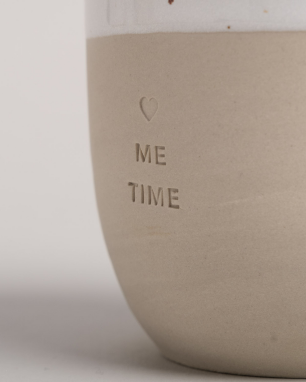 Me Time Stoneware Mug | 320ml | Handcrafted in Portugal Create perfect moments of calm with our handcrafted "Me Time" stoneware mug. Each 320ml mug is lovingly made in a small Portuguese pottery, featuring a mindful embossed message. Every piece is unique, with natural variations in glaze and texture that make it special. Dishwasher-safe and perfectly sized at 8.5-9cm height, it's your ideal companion for daily moments of peace.