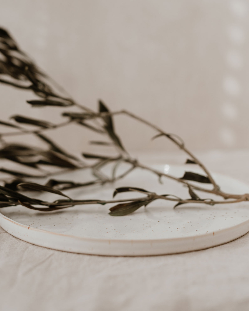 Elevate your dining experience with our handcrafted Calma dinner plate. Each 27cm plate features natural glaze variations and improved stackable design. Perfectly sized for main courses, this dishwasher-safe plate combines artisanal beauty with modern practicality.