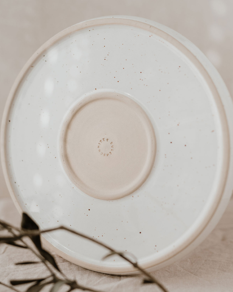Elevate your dining experience with our handcrafted Calma dinner plate. Each 27cm plate features natural glaze variations and improved stackable design. Perfectly sized for main courses, this dishwasher-safe plate combines artisanal beauty with modern practicality.