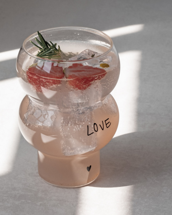 Celebrate love with our Double Bubble glass featuring elegant "Love" lettering and heart detail. This 450ml glass combines style with sentiment, perfect for special occasions or adding romance to everyday moments. Standing elegantly at 12.8cm tall with an 8.9cm width, it's perfectly sized for everything from refreshing cocktails to creative desserts. Dishwasher safe.