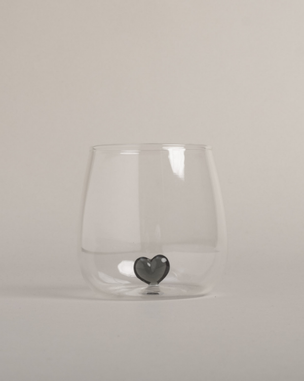 Elevate your drinkware with this unique black heart drinking glass. Featuring a striking 3D black heart design floating inside a high-quality glass, this piece adds a touch of elegance to any occasion. Perfect for everyday use or special gatherings, this glass is both beautiful and practical.