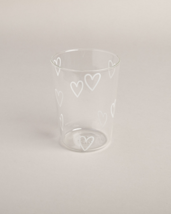 Fall in love with this charming glass tumbler featuring delicate white hearts! Perfect for everyday use, this 450ml drinking glass adds a touch of romance to your beverage experience.