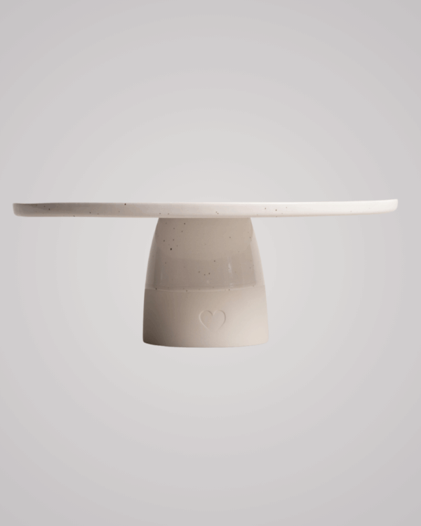 Showcase your cakes beautifully with our handmade Calma stoneware cake stand, now in 7cm and 10cm heights. Featuring a 28cm diameter, unique glaze, and easy-to-clean surface, it's perfect for celebrations and stylish decoration. Use both sizes together for a tiered display!