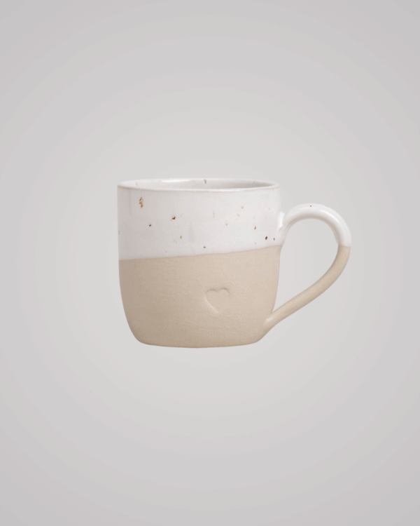 Sip with love from our handcrafted espresso cup featuring a subtle blind embossed heart design and practical handle. Unique stoneware charm. Dishwasher and microwave safe. Capacity: 60 ml (usable), 80 ml (full).