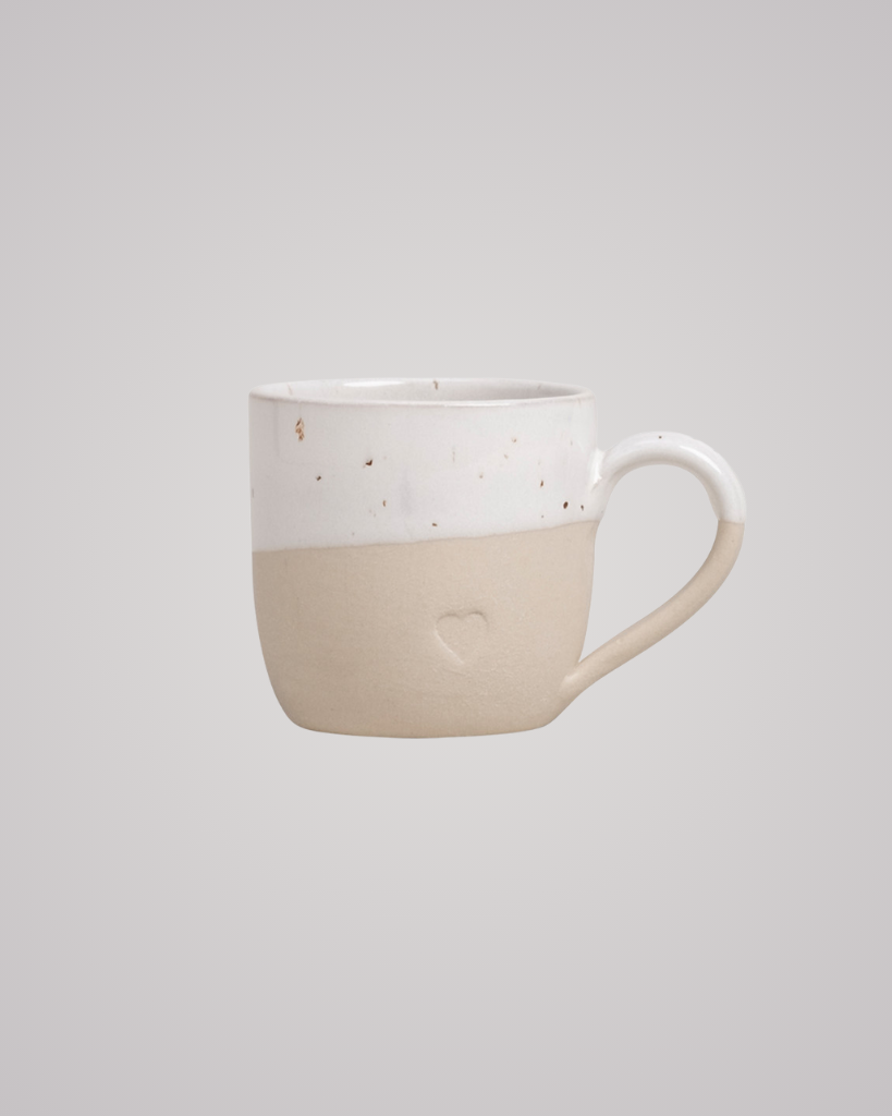 Sip with love from our handcrafted espresso cup featuring a subtle blind embossed heart design and practical handle. Unique stoneware charm. Dishwasher and microwave safe. Capacity: 60 ml (usable), 80 ml (full).