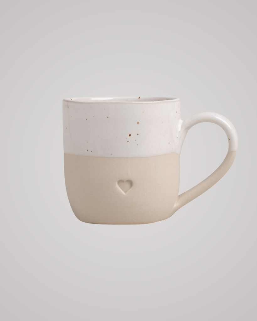 Discover your perfect cappuccino cup! Our handmade stoneware mug features a signature blind embossed heart design and ideal capacity for your favorite coffees. Dishwasher and microwave safe. Capacity: 150 ml (usable), 190 ml (full).