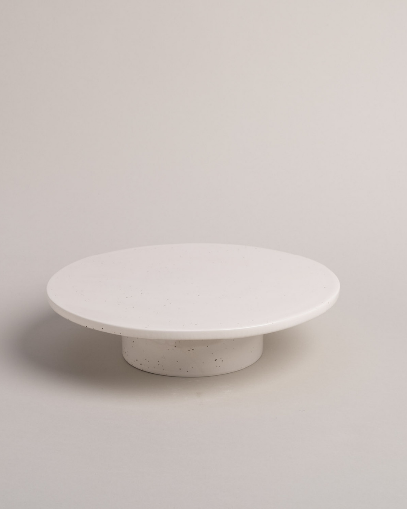 Showcase your cakes beautifully with our handmade Calma stoneware cake stand, now in 7cm and 10cm heights. Featuring a 28cm diameter, unique glaze, and easy-to-clean surface, it's perfect for celebrations and stylish decoration. Use both sizes together for a tiered display!