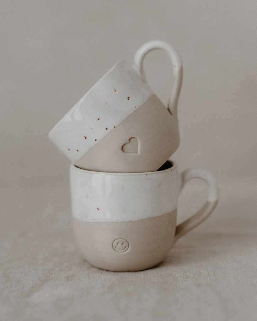 Sip with love from our handcrafted espresso cup featuring a subtle blind embossed heart design and practical handle. Unique stoneware charm. Dishwasher and microwave safe. Capacity: 60 ml (usable), 80 ml (full).
