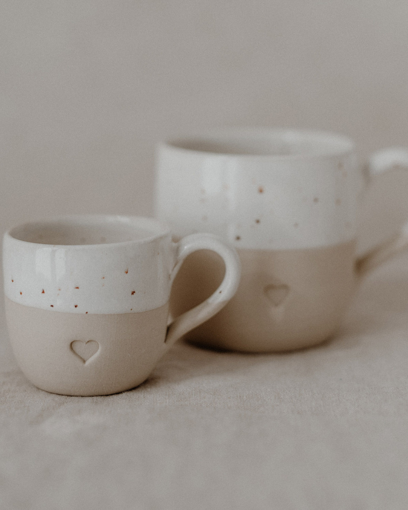 Sip with love from our handcrafted espresso cup featuring a subtle blind embossed heart design and practical handle. Unique stoneware charm. Dishwasher and microwave safe. Capacity: 60 ml (usable), 80 ml (full).