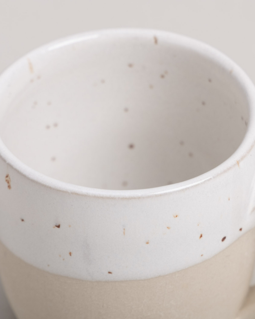 Sip with love from our handcrafted espresso cup featuring a subtle blind embossed heart design and practical handle. Unique stoneware charm. Dishwasher and microwave safe. Capacity: 60 ml (usable), 80 ml (full).