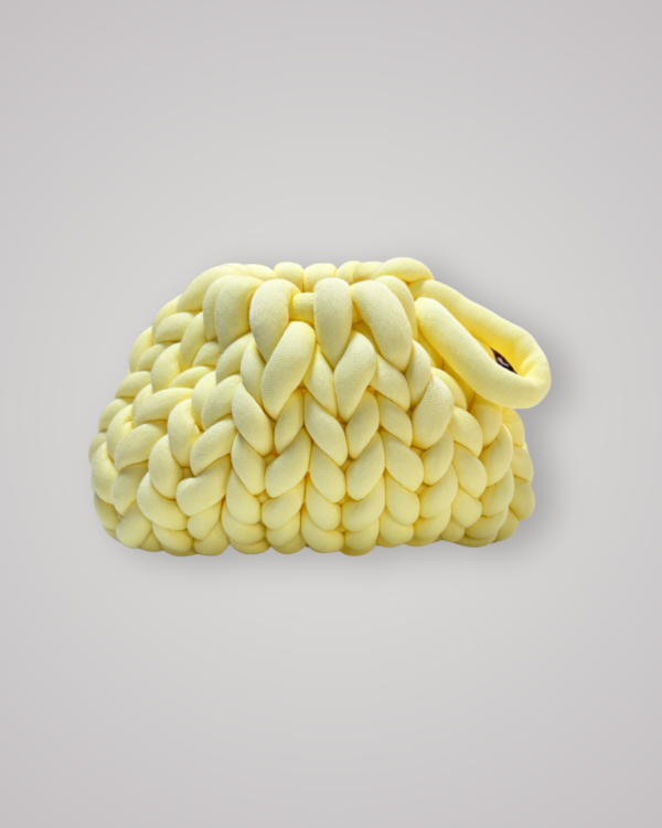Hand-crocheted chunky yarn bag in a soft butter yellow colour