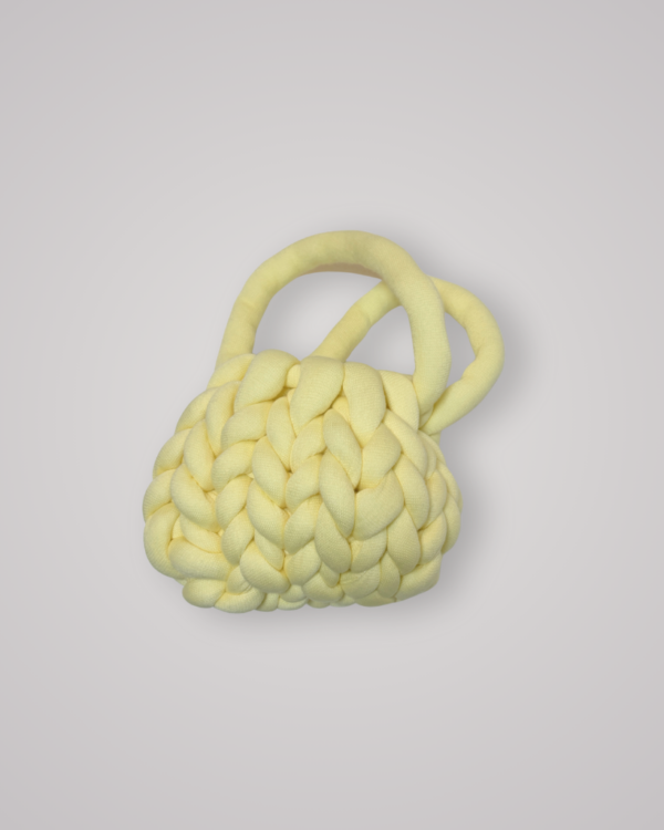 Hand-crocheted chunky yarn bag in a soft butter yellow colour