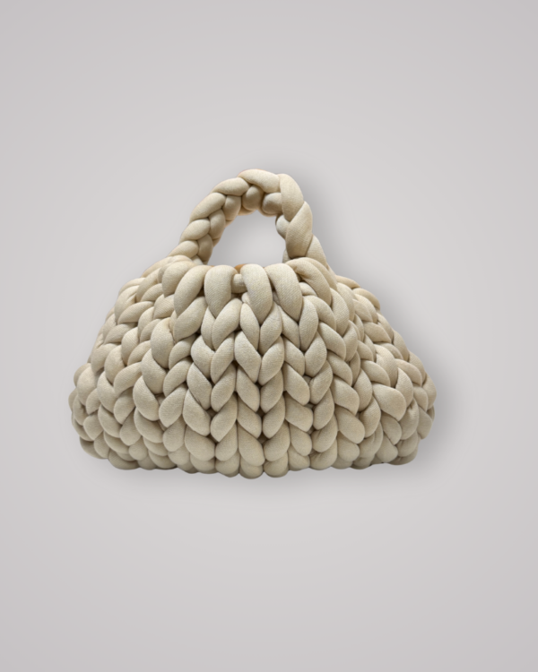 Hand-crocheted chunky yarn bag in a soft off-white Glazing Milk color.